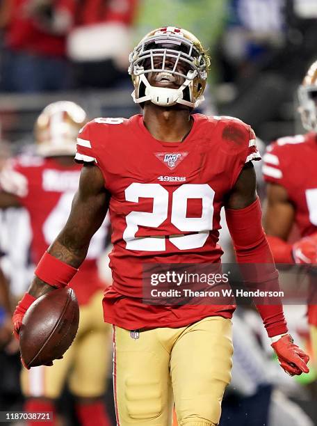 Strong safety Jaquiski Tartt of the San Francisco 49ers celebrates stripping the ball from wide receiver D.K. Metcalf of the Seattle Seahawks at the...