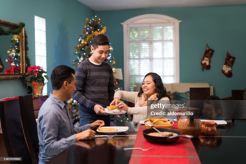 Mexican family on Christmas eating together