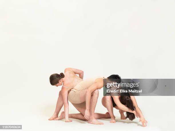 group of dancers leaning on each - body-bending-forward stock pictures, royalty-free photos & images