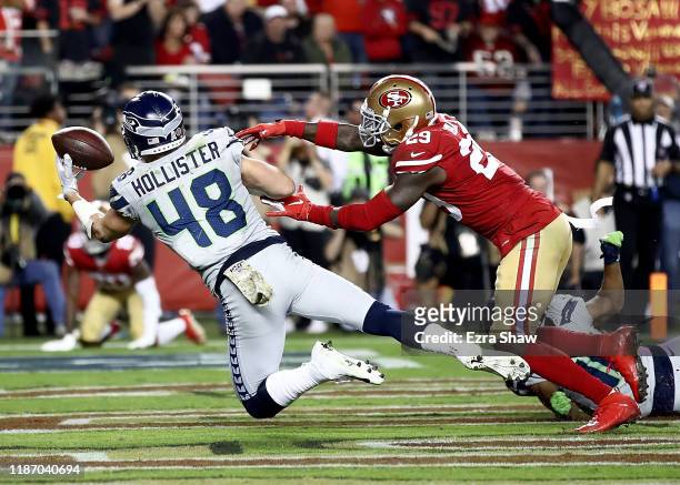 Tight end Jacob Hollister of the Seattle Seahawks catches a pass for a touchdown over strong safety Jaquiski Tartt of the San Francisco 49ers in the...