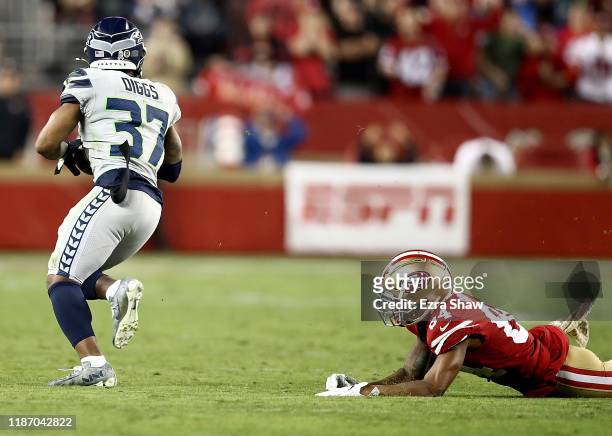 Defensive back Quandre Diggs of the Seattle Seahawks intercepts the ball intended for wide receiver Kendrick Bourne of the San Francisco 49ers during...