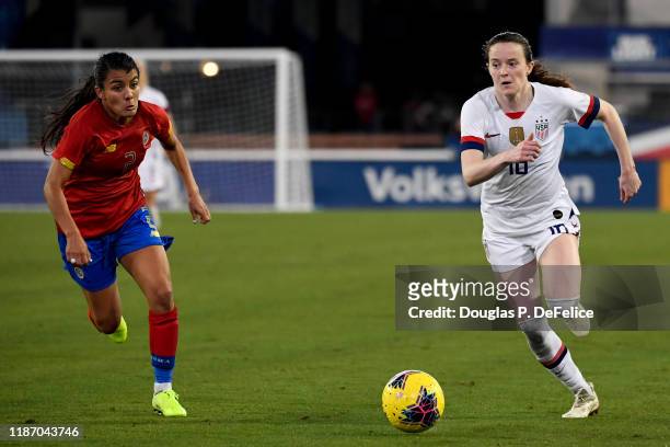 Rose Lavelle of the U.S. Woman's national soccer team dribbles the ball as Gabriela Guillen of the Costa Rica woman's national soccer team defends...