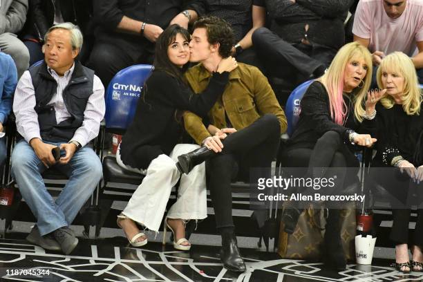 Camila Cabello and Shawn Mendes attend a basketball game between the Los Angeles Clippers and the Toronto Raptors at Staples Center on November 11,...