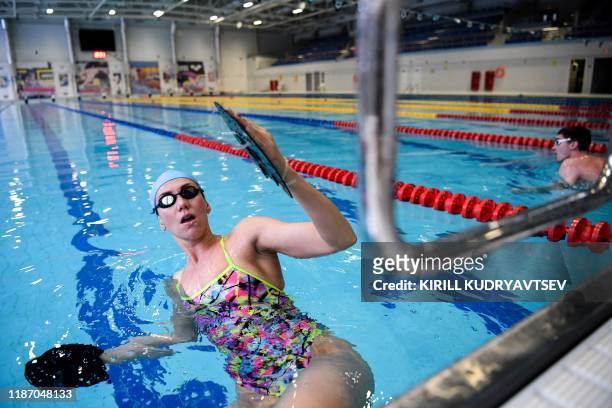 Anastasia Fesikova trains in a swimming pool in the town of Obninsk in the Kaluga region, about 100 kilometres from Moscow, on December 3, 2019. -...
