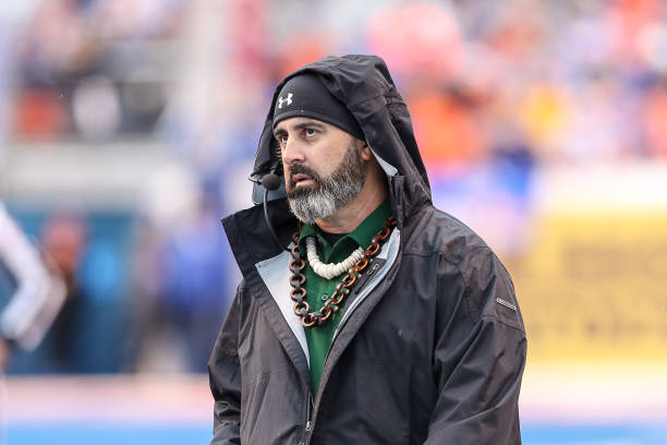 Head Coach Nick Rolovich of the Hawaii Rainbow Warriors watches a replay during second half action in the Mountain West Championship against the...
