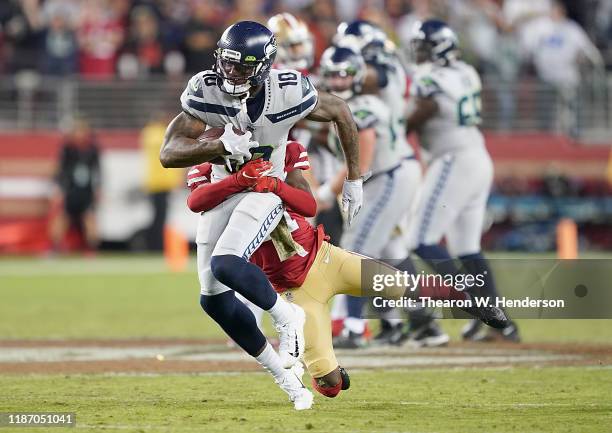 Wide receiver Josh Gordon of the Seattle Seahawks is tackled by the defense of the San Francisco 49ers in the game at Levi's Stadium on November 11,...