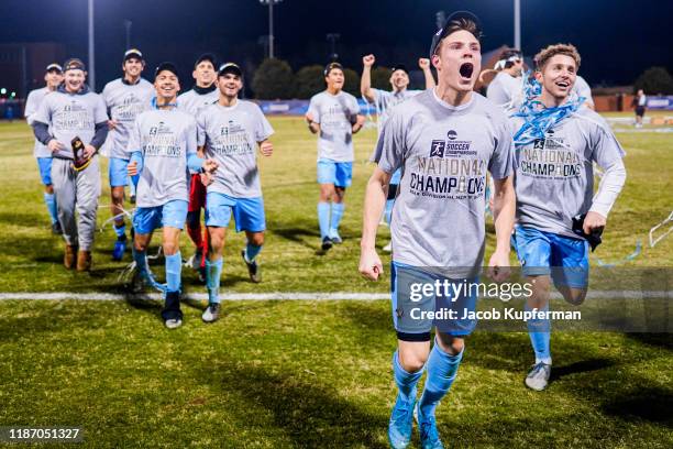 Tufts Jumbos players celebrate after their win during the Division III Men's Soccer Championship held at UNCG Soccer Stadium on December 7, 2019 in...