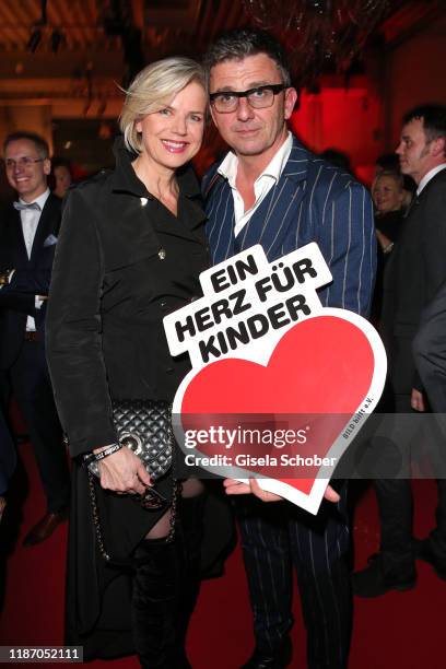 Hans Sigl and his wife Susanne Sigl during the Ein Herz Fuer Kinder Gala at Studio Berlin Adlershof on December 7, 2019 in Berlin, Germany.