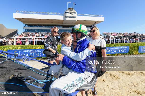 Blair Orange driving Cruz Bromac receives a hug from his son Harrison after winning Race 10 Christchurch Casino New Zealand Trotting Cup during the...