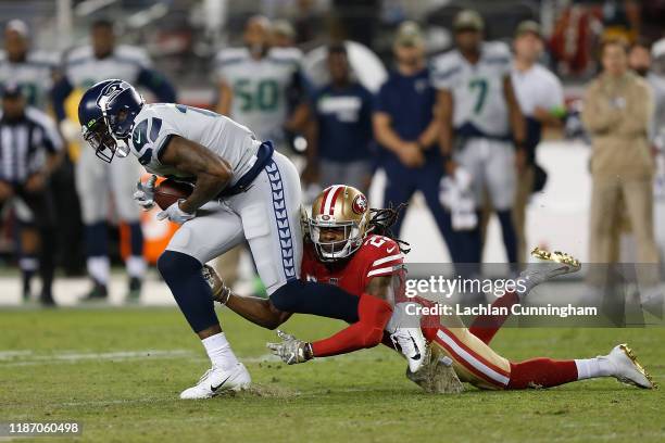 Josh Gordon of the Seattle Seahawks is tackled by Richard Sherman of the San Francisco 49ers in over time at Levi's Stadium on November 11, 2019 in...