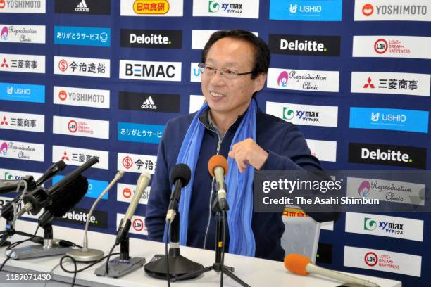 Imabari owner Takeshi Okada attends a press conference after his side's promotion to the J.League J3 after their victory in the JFL match between FC...
