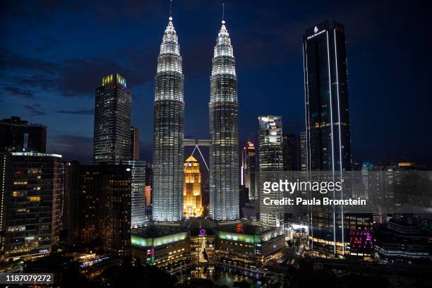 The Petronas Twin Towers are seen in the skyline at the peak of the Christmas holiday season in Kuala Lumpur, Malaysia on December 6, 2019. Shopping...