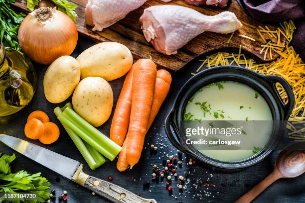 ingredients for cooking chicken broth - broth stock pictures, royalty-free photos & images