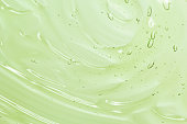 Green aloe vera cosmetic gel texture background