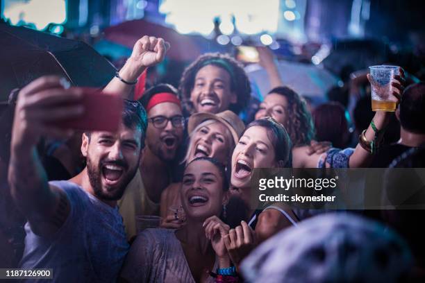 hey guys, let's take a selfie on this music festival! - festival selfie stock pictures, royalty-free photos & images