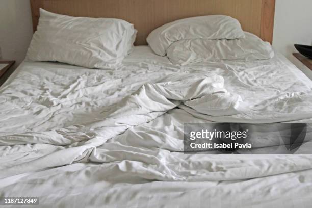 unmade bed in the morning - desire stock photos et images de collection