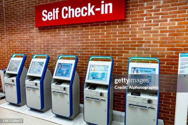 self check-in terminals at venice marco polo airport - venice airport stock pictures, royalty-free photos & images