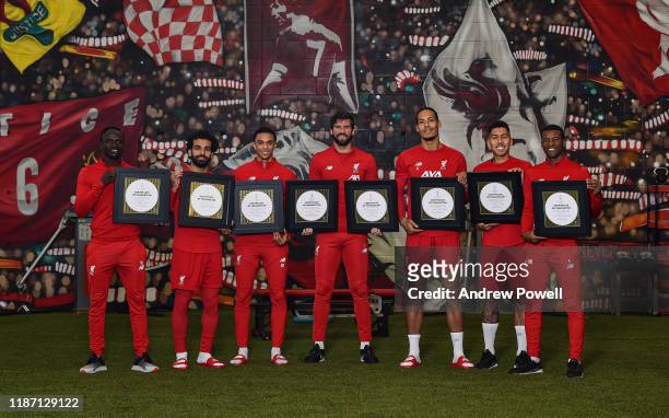 Sadio Mane, Mohamed Salah, Trent Alexander-Arnold, Alisson Becker, Virgil van Dijk, Roberto Firmino and Georginio Wijnaldum of Liverpool pose for a...