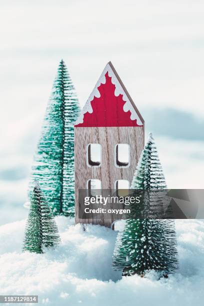 christmas composition with christmas tree and wooden european toy house on the snow isolated on white background - christmas toys wooden background stockfoto's en -beelden