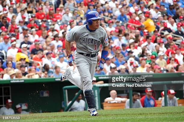 Kosuke Fukudome of the Chicago Cubs runs to first against the Washington Nationals at Nationals Park on July 4, 2011 in Washington, DC. The...