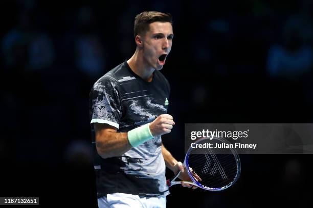 Joe Salisbury of Great Britain, playing partner of Rajeev Ram of the USA celebrates in their doubles match against Ivan Dodig of Croatia and Filip...