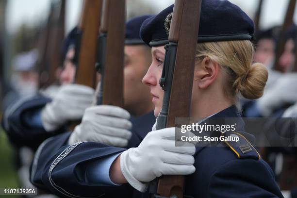 Male and female members of the Bundeswehr, the German armed forces, prepare to participate in a ceremony in which new recruits took their oath of...