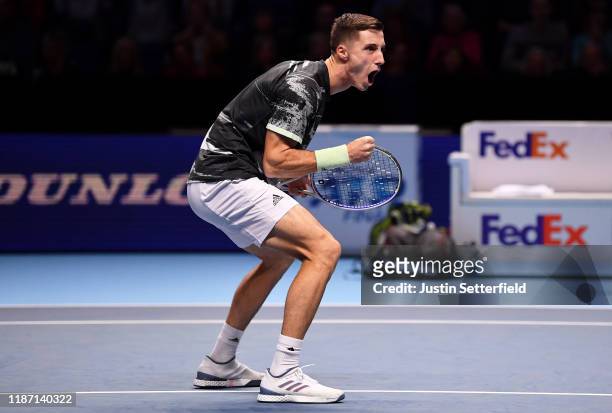 Joe Salisbury of Great Britain, playing partner of Rajeev Ram of the USA celebrates in their doubles match against Ivan Dodig of Croatia and Filip...