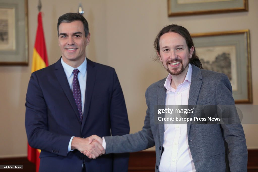 Pedro Sanchez (PSOE) And Pablo Iglesias (Unidas Podemos) Sign In The Parliament Their Agreement For A Coalition Government