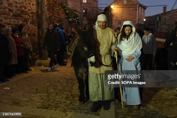 Couple portray Virgin Mary and Joseph during the live nativity scene in the small village of Oncala, north of Spain. Villagers of the Spanish village...