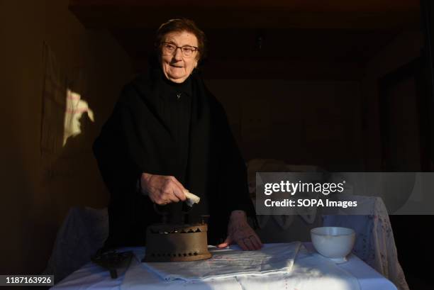 Woman dressed in traditional costume irons during the live nativity scene in the small village of Oncala, north of Spain. Villagers of the Spanish...