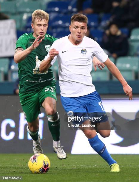 Andrei Mostovoy of PFC Sochi vies for the ball with Oleh Danchenko of FC Rubin Kazan during the Russian Premier League match between PFC Sochi v FC...