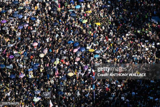 People gather at Victoria Park for a pro-democracy rally in Hong Kong on December 8, 2019. Vast crowds of democracy protesters thronged Hong Kong's...