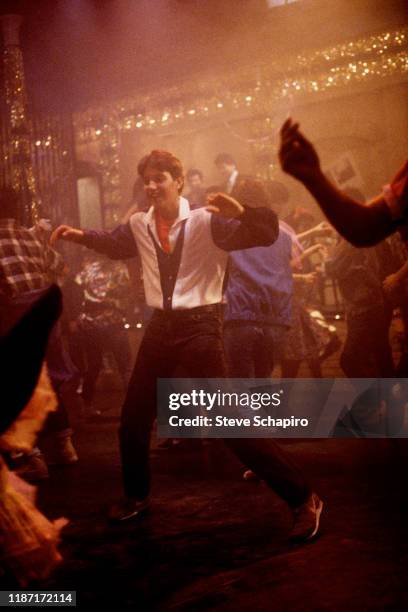 American actor Ralph Macchio dances in a scene from the film 'The Karate Kid Part II' , 1986.