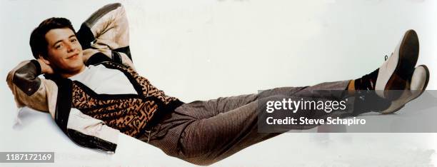 Portrait of American actor Matthew Broderick from the film 'Ferris Bueller's Day Off' as he poses against a white background, 1986.