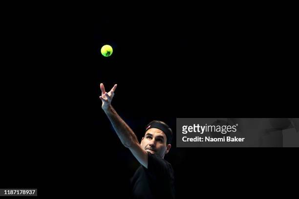 Roger Federer of Switzerland serves during his singles match against Matteo Berrettini of Italy during Day Three of the Nitto ATP Finals at The O2...