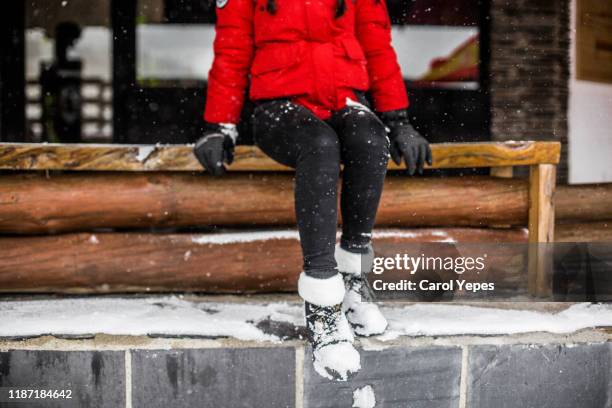 low section woman with boots covered in snow - leggings fotografías e imágenes de stock