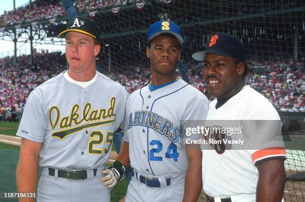 Mark McGwire of the Oakland A's, Ken Griffey Jr. Of the Seattle Mariners, and Kevin Mitchell of the San Francisco Giants pose before the 1990 MLB All...