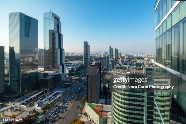 seoul skyline, teheran-ro street at gangnam station - seoul stock pictures, royalty-free photos & images