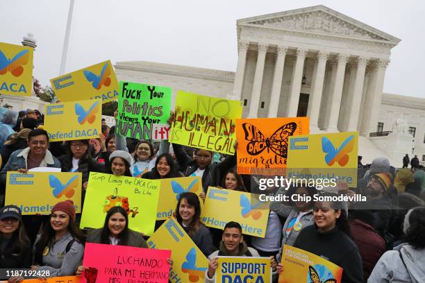 People gather outside the U.S. Supreme Court to rally in support of the Deferred Action on Childhood Arrivals program as the court hears arguments...