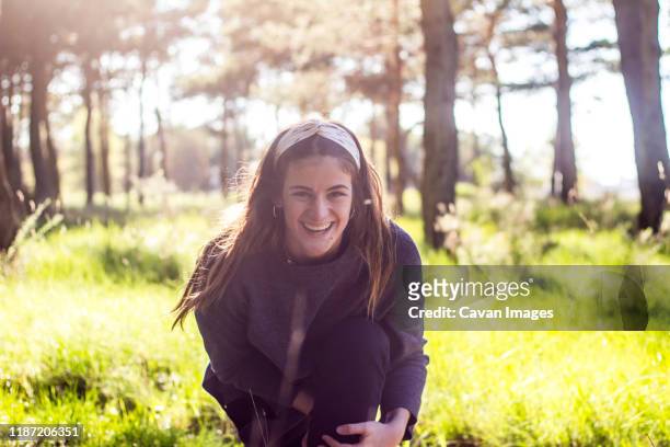 girl smiling in the forest on nature at sunset - diadema fotografías e imágenes de stock