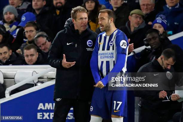 Brighton's English manager Graham Potter speaks with Brighton's English striker Glenn Murray on the touchline during the English Premier League...