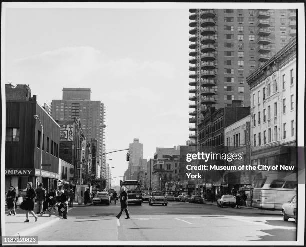 View looking east of pedestrian and vehicular traffic on 86th Street from Lexington Avenue, New York, New York, circa 1974.