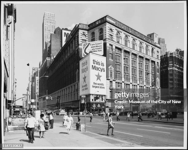 View of pedestrians walking outside Macy's Herald Square department store, New York, New York, circa 1975.