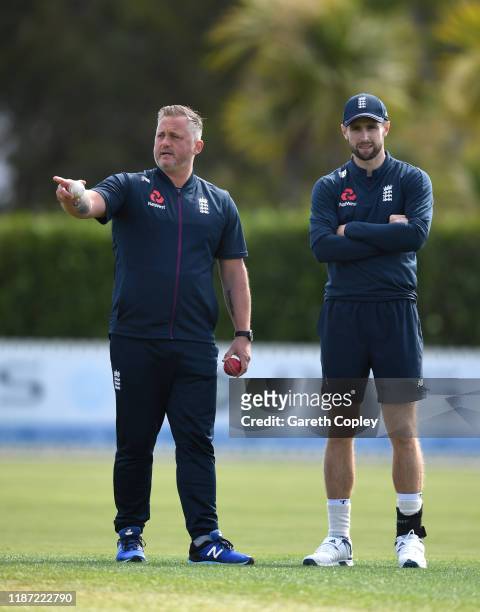 England coach Darren Gough speaks with Chris Woakes ahead of the tour match between New Zealand XI and England at Cobham Oval on November 13, 2019 in...