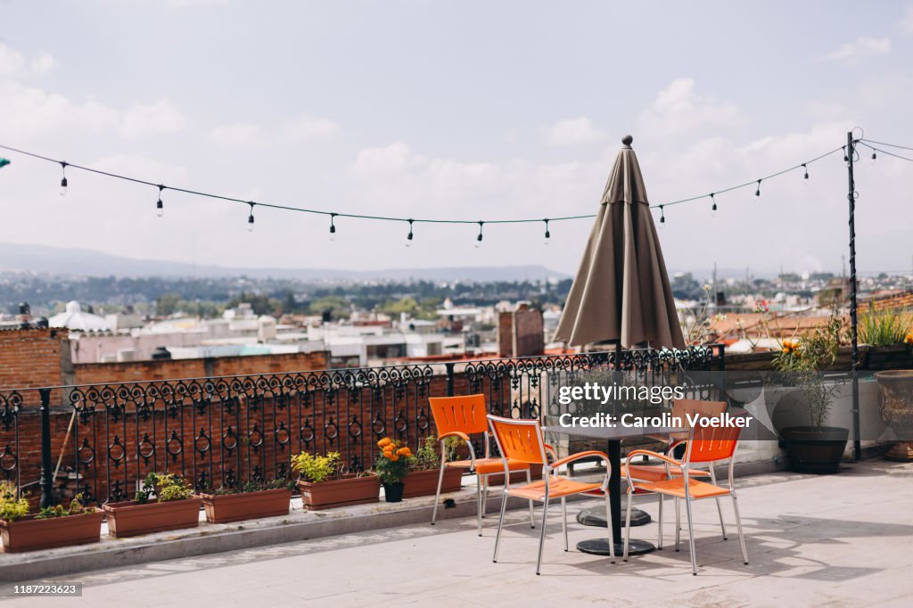 Terrace with table and four chairs overlooking the Morelia city center