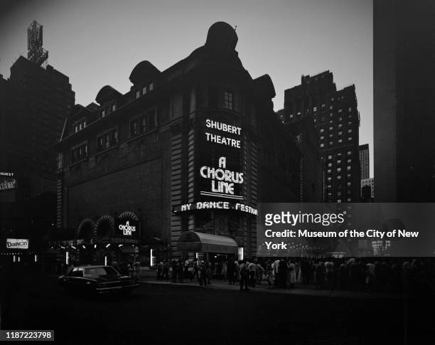 Nighttime view of crowds outside the Schubert Theater at 225 West 44th Street for a performance of the musical 'A Chorus Line', New York, New York,...