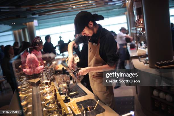 Worker prepares drinks during a media preview at Starbucks Reserve Roastery on November 12, 2019 in Chicago, Illinois. With 35,000 square feet over...