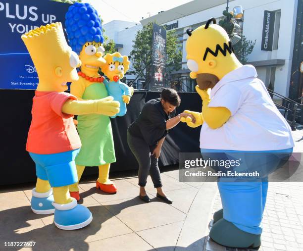 Bart Simpson, Marge Simpson, Maggie Simpson, Yvette Nicole Brown, and Homer Simpson at the Disney+ Official U.S. Launch Party at The Grove at The...