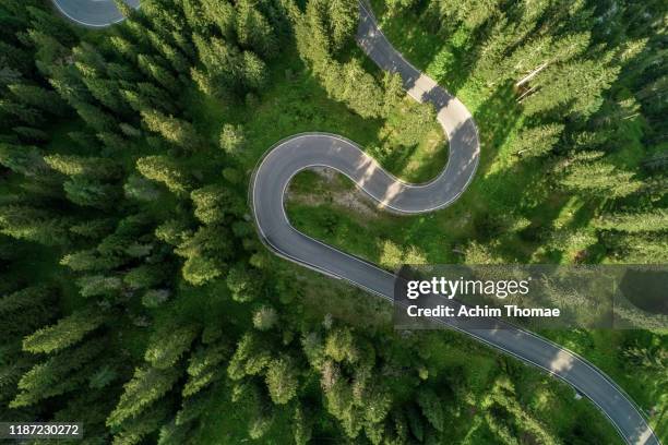 aerial view of an alpine road - aerial mountain pass imagens e fotografias de stock