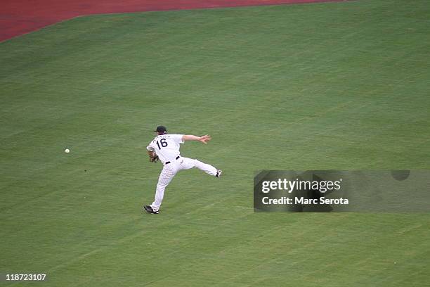 Outfielder Bryan Peterson of the Florida Marlins cannot make a catch against the Philadelphia Phillies at Sun Life Stadium on July 6, 2011 in Miami...